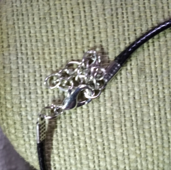 Goldtone shiny pendant on black cord necklace - Picture 4 of 5